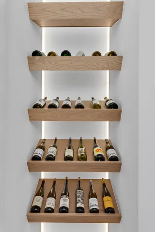 a bathroom with a toilet a sink and a mirror