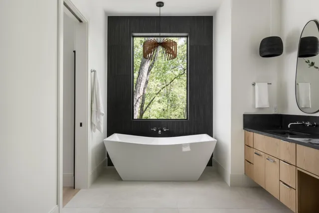 a bedroom with bed and window