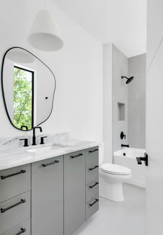 a view of a swimming pool with a table and chairs under an umbrella