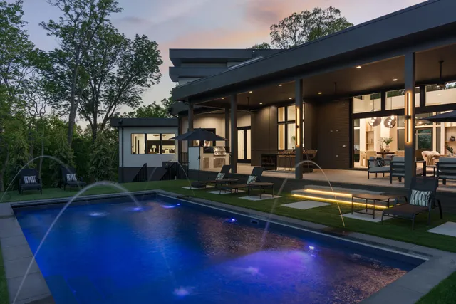 a living room with furniture a window and flat screen tv