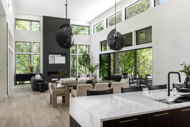 a kitchen with stainless steel appliances a sink and a refrigerator