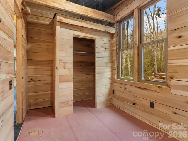 a bathroom with a toilet a sink and a window