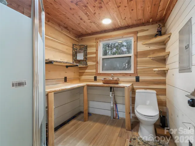 a view of a chairs and table in the back yard