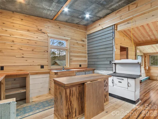 a kitchen that has a sink and a stove