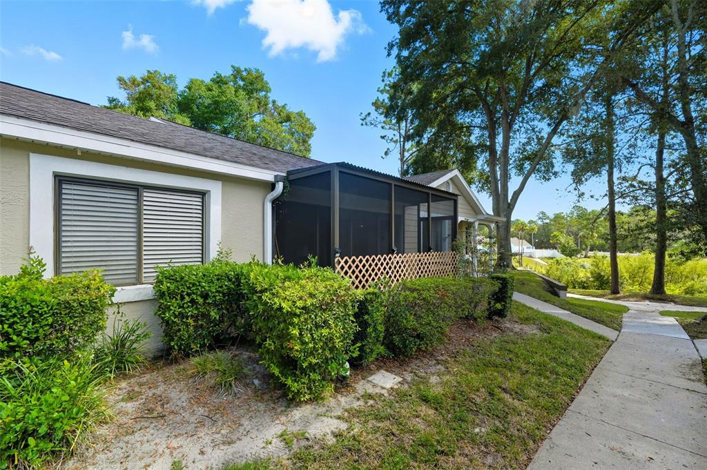 8174 Sturbridge Court, Unit 8174 Weeki Wachee, FL 34613 - Photo 26 of 32 a front view of a house with garden