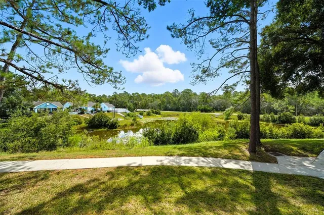 a view of a lake with houses in the back