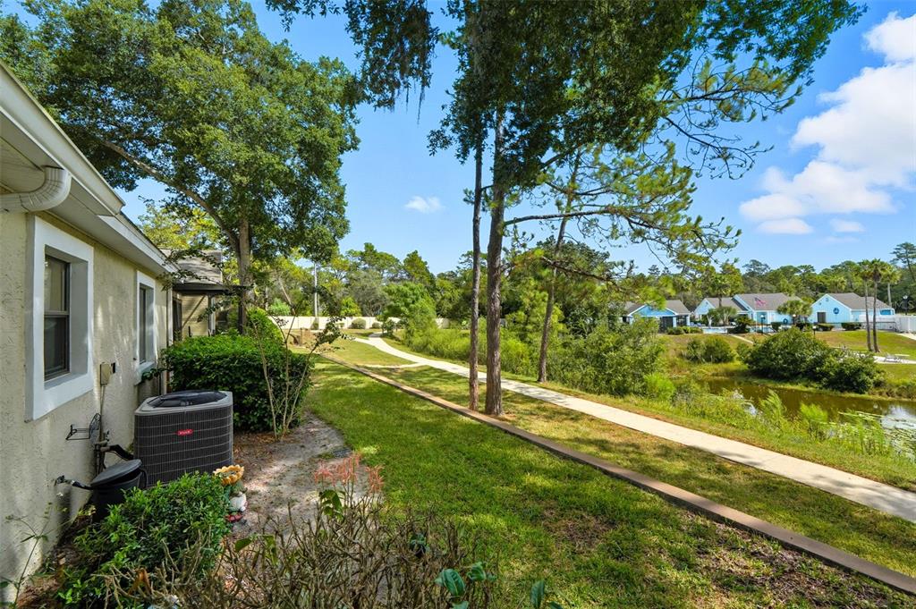 8174 Sturbridge Court, Unit 8174 Weeki Wachee, FL 34613 - Photo 30 of 32 a view of a garden with houses