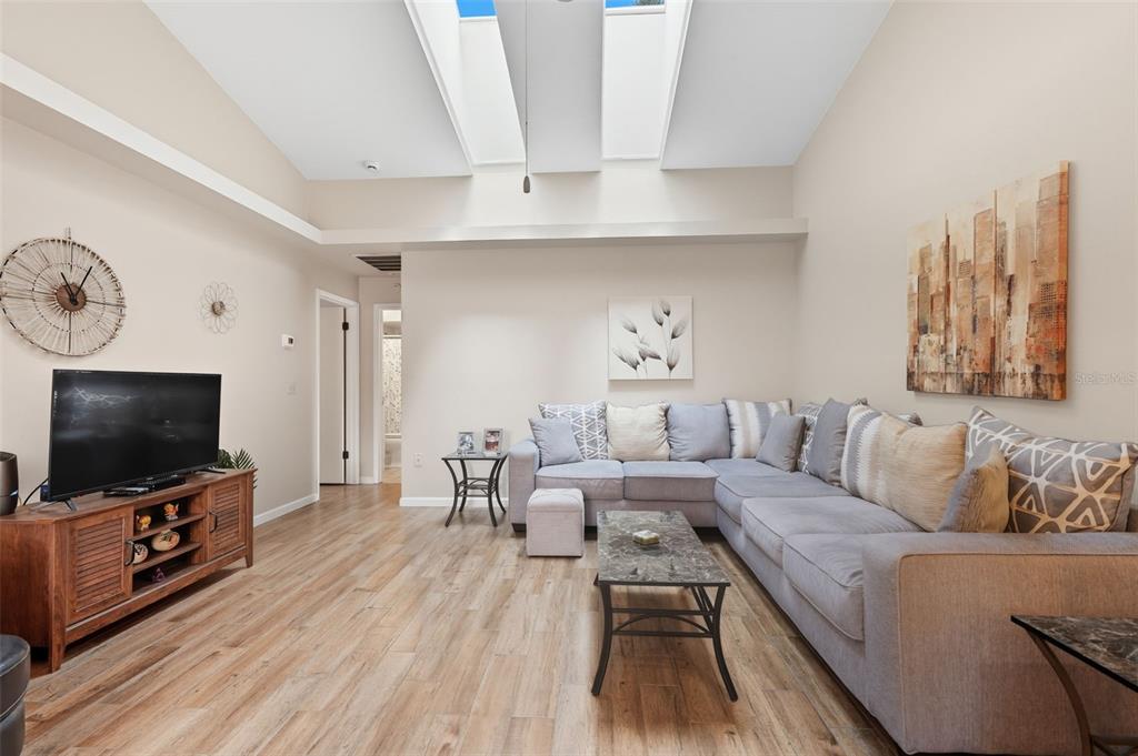 8174 Sturbridge Court, Unit 8174 Weeki Wachee, FL 34613 - Photo 7 of 32 a living room with furniture and a flat screen tv