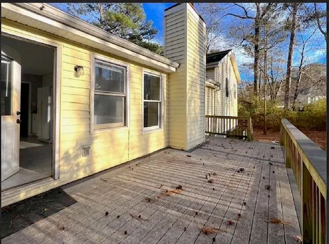 a view of a brick house with many windows