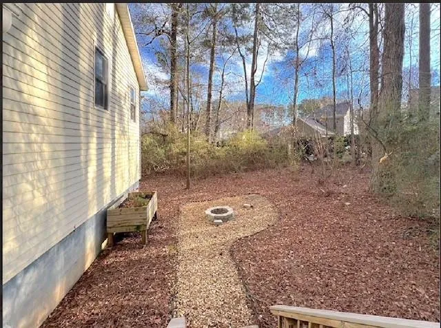 a backyard of a house with lots of green space