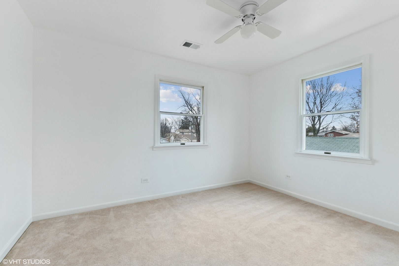 11034 Bryant Road Mokena, IL 60448 - Photo 13 of 19 an empty room with a ceiling fan and window
