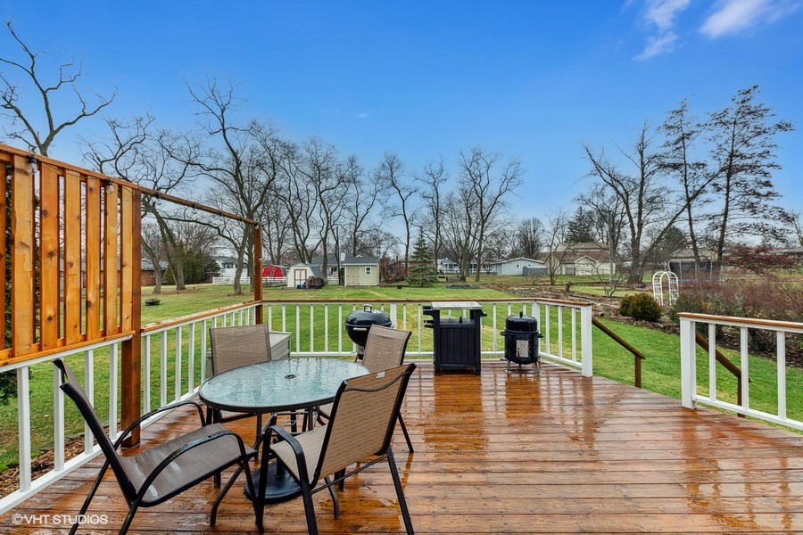 11034 Bryant Road Mokena, IL 60448 - Photo 2 of 19 a view of a chairs and table on the deck