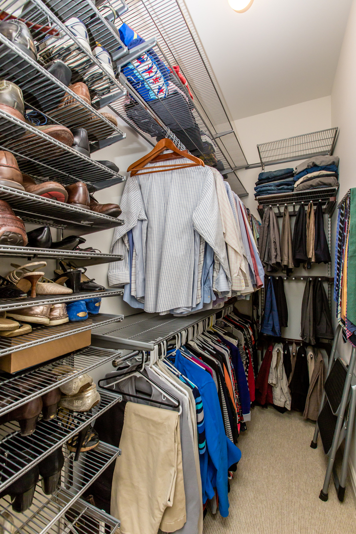 35 South Racine Avenue, Unit 4SE Chicago, IL 60607 - Photo 11 of 24 a view of walk in closet with clothes and shoes