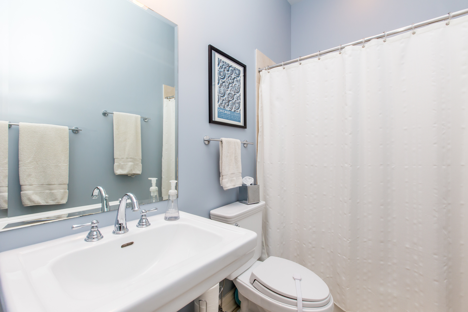 35 South Racine Avenue, Unit 4SE Chicago, IL 60607 - Photo 18 of 24 a bathroom with a sink a toilet and mirror