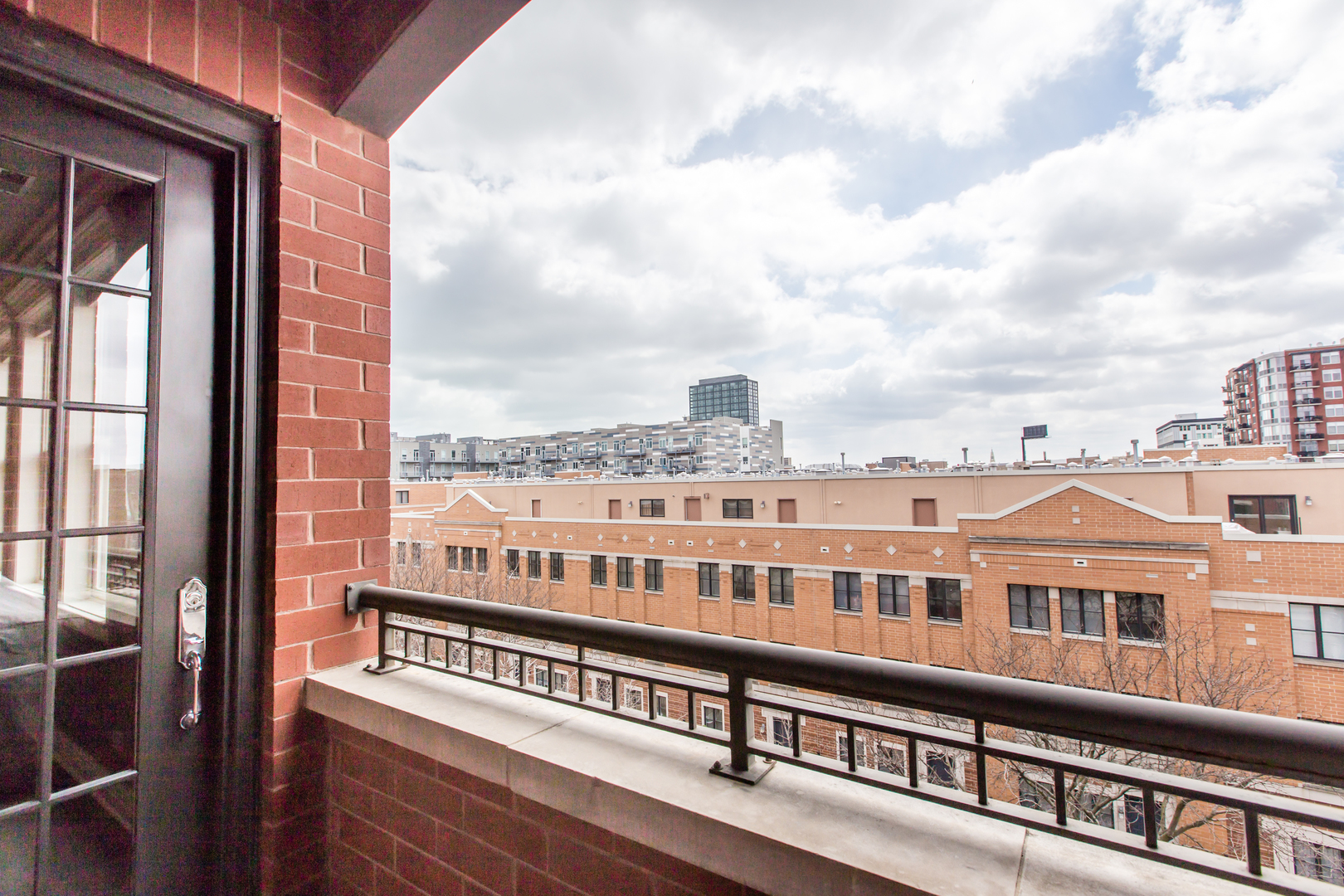 35 South Racine Avenue, Unit 4SE Chicago, IL 60607 - Photo 20 of 24 a view of a building from a balcony