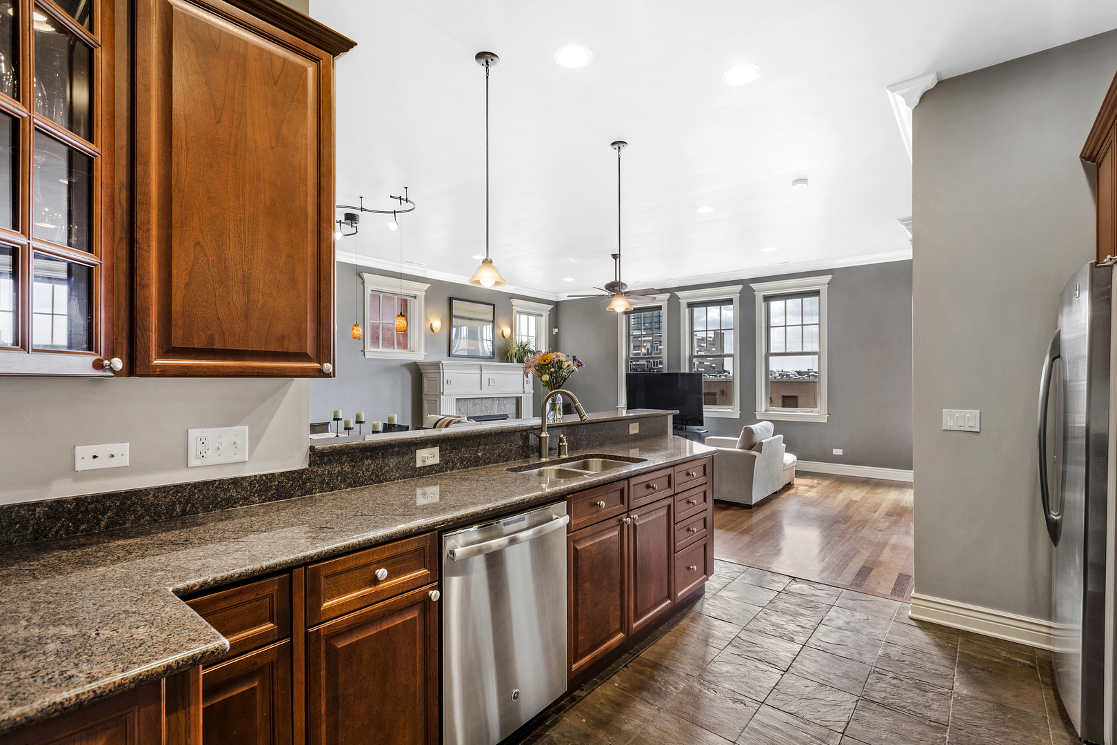 35 South Racine Avenue, Unit 4SE Chicago, IL 60607 - Photo 6 of 24 a kitchen with stainless steel appliances granite countertop a sink a counter space and cabinets