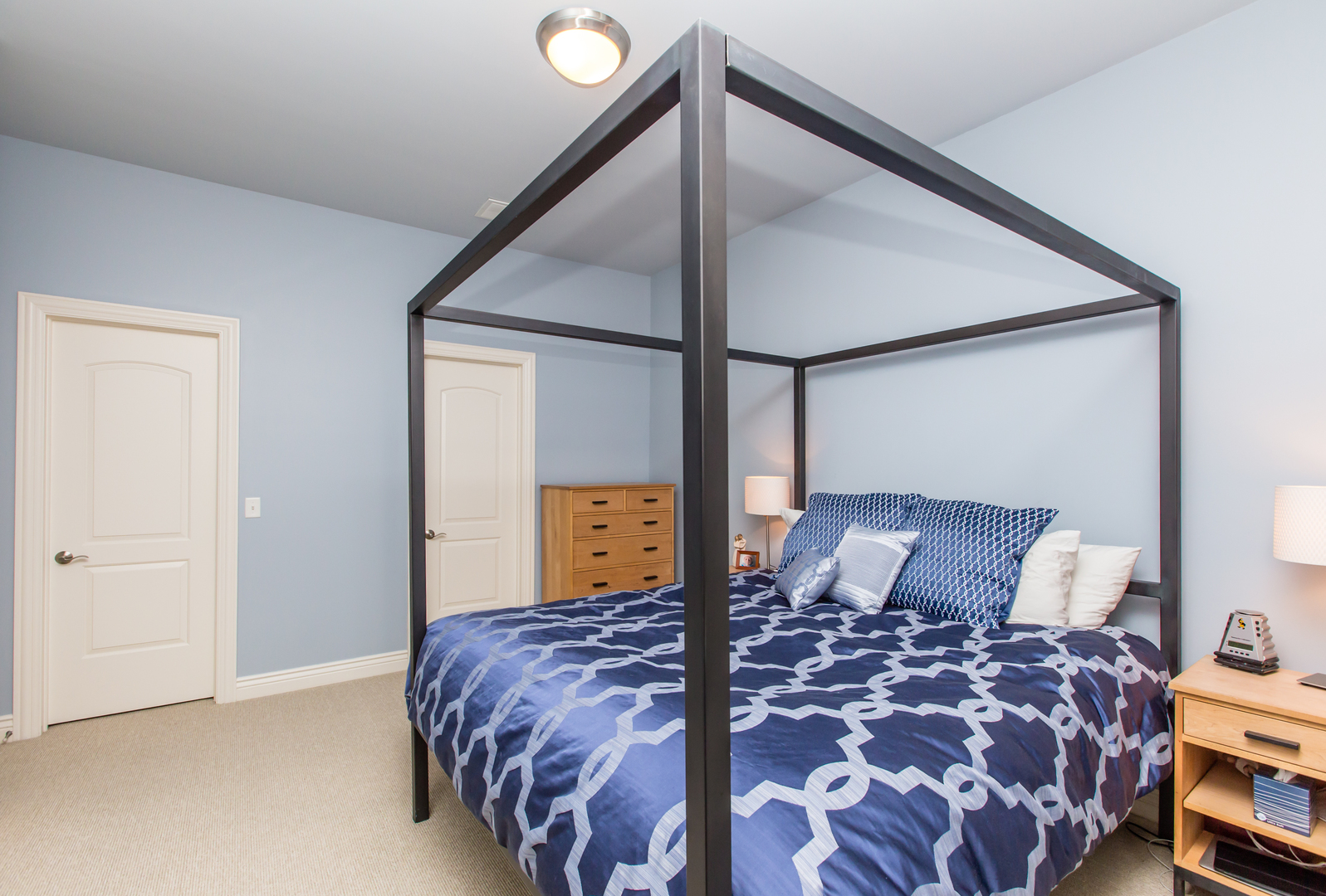 35 South Racine Avenue, Unit 4SE Chicago, IL 60607 - Photo 8 of 24 a bedroom with a bed and a painting on the wall