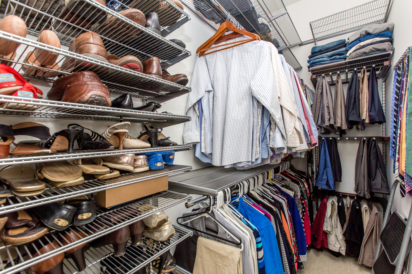 35 South Racine Avenue, Unit 4SE Chicago, IL 60607 - Photo 10 of 24 a view of walk in closet with clothes and shoes