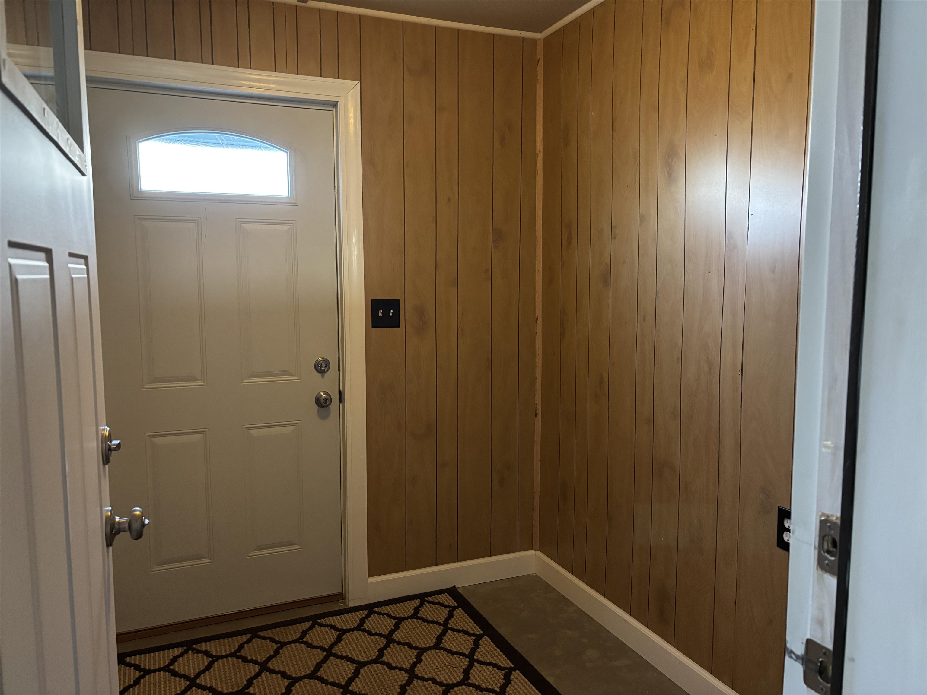 21 Oak Street Proctor, MN 55810 - Photo 23 of 26 Doorway to outside with wooden walls and baseboards