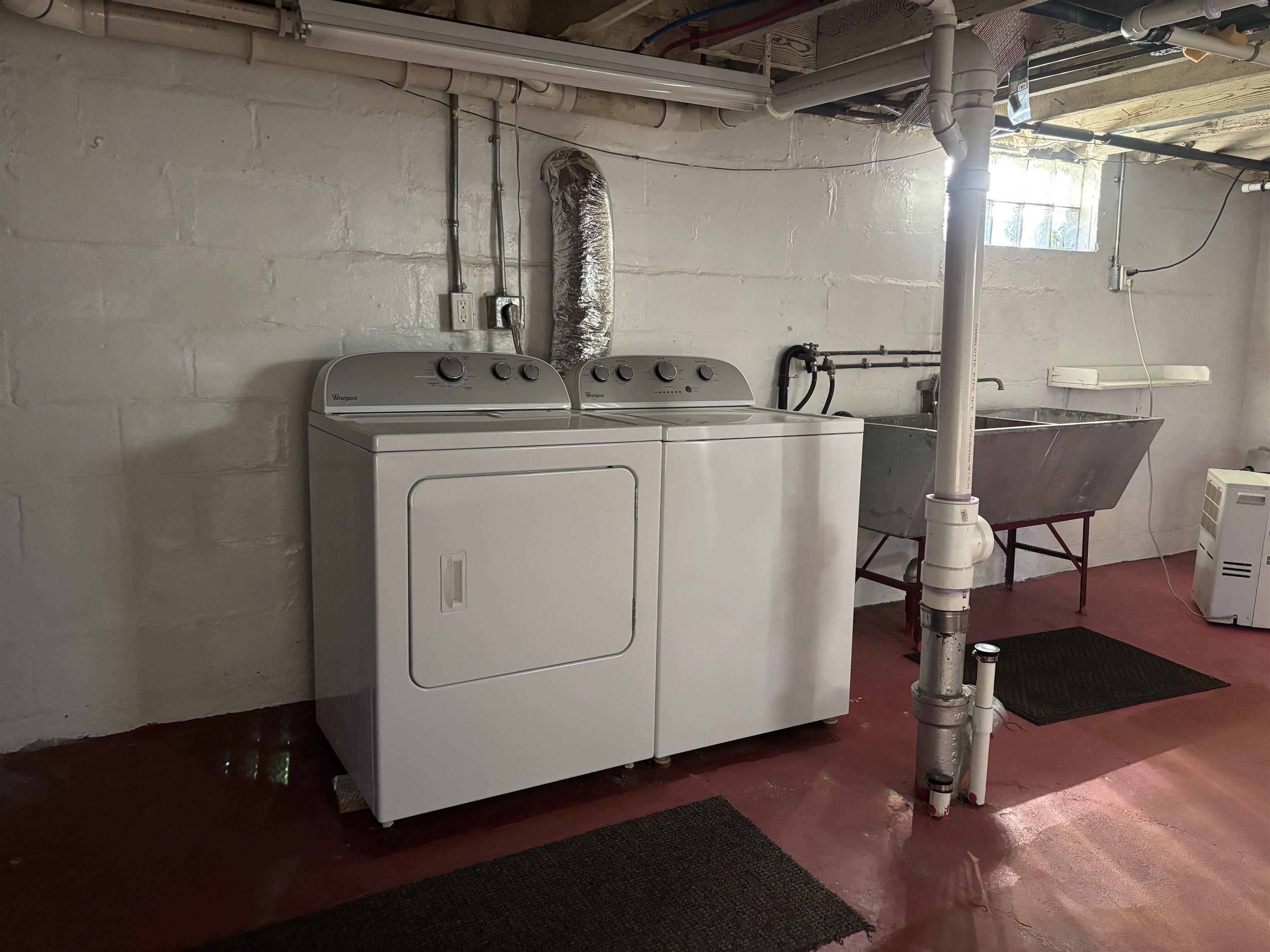 21 Oak Street Proctor, MN 55810 - Photo 26 of 26 Laundry room featuring washer and clothes dryer and concrete flooring