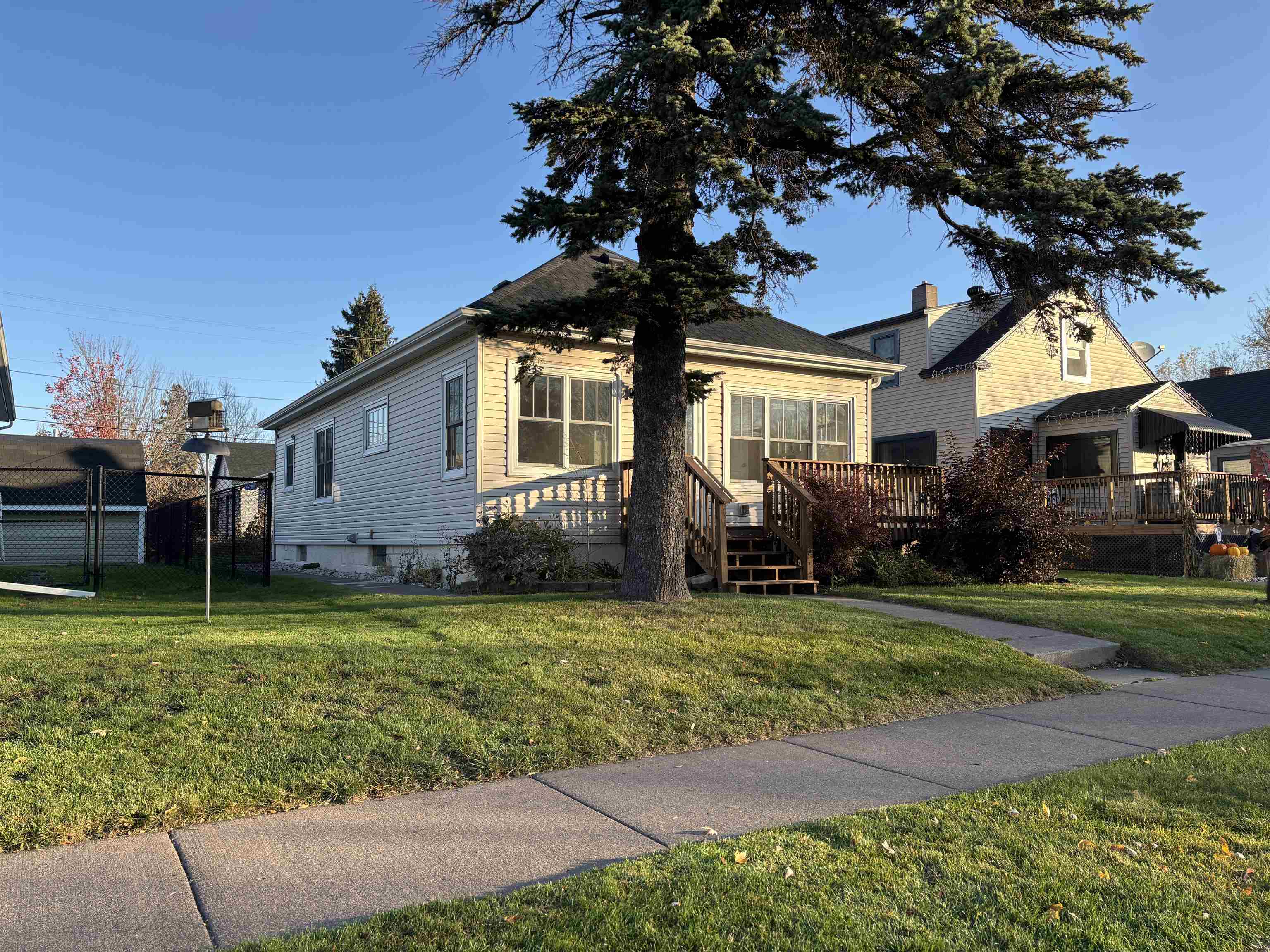 Bungalow-style house with a deck