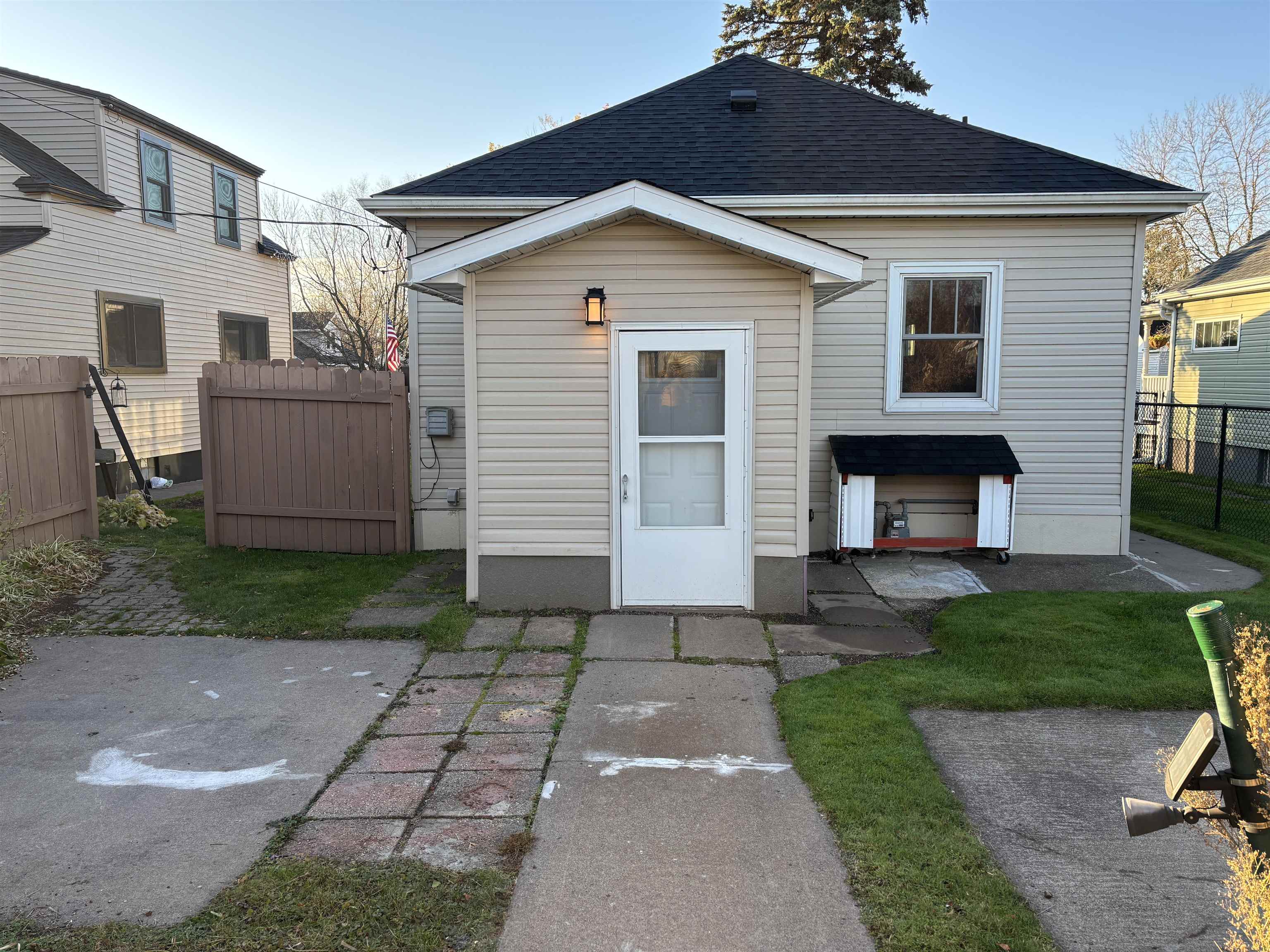 Rear view of house with a shingled roof