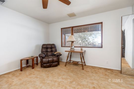 1029 Leslie Street Ridgecrest, CA 93555 - Photo 22 of 40 a room with furniture and a window