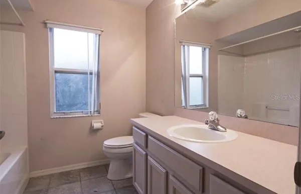 a front view of a house with a yard and porch