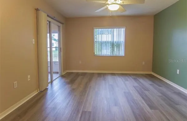 a bathroom with a granite countertop sink a shower and a mirror
