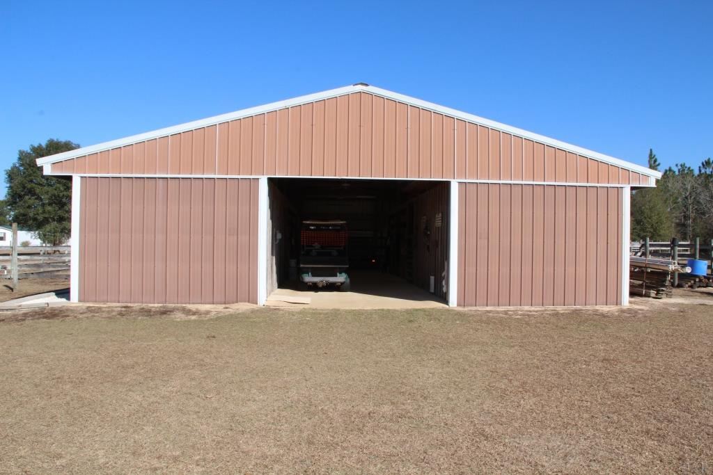 6124 Riverchase Road Milton, FL 32583 - Photo 2 of 49 With four 12' x 10' Stalls w/ mats, lights & fans