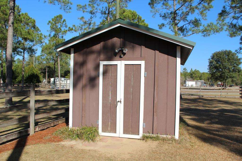 6124 Riverchase Road Milton, FL 32583 - Photo 41 of 49 Storage Shed Near Brick Home