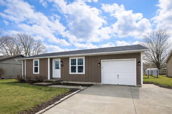 a house with yard in front of it