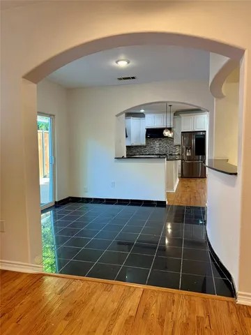 a kitchen with stainless steel appliances a stove a sink and a microwave