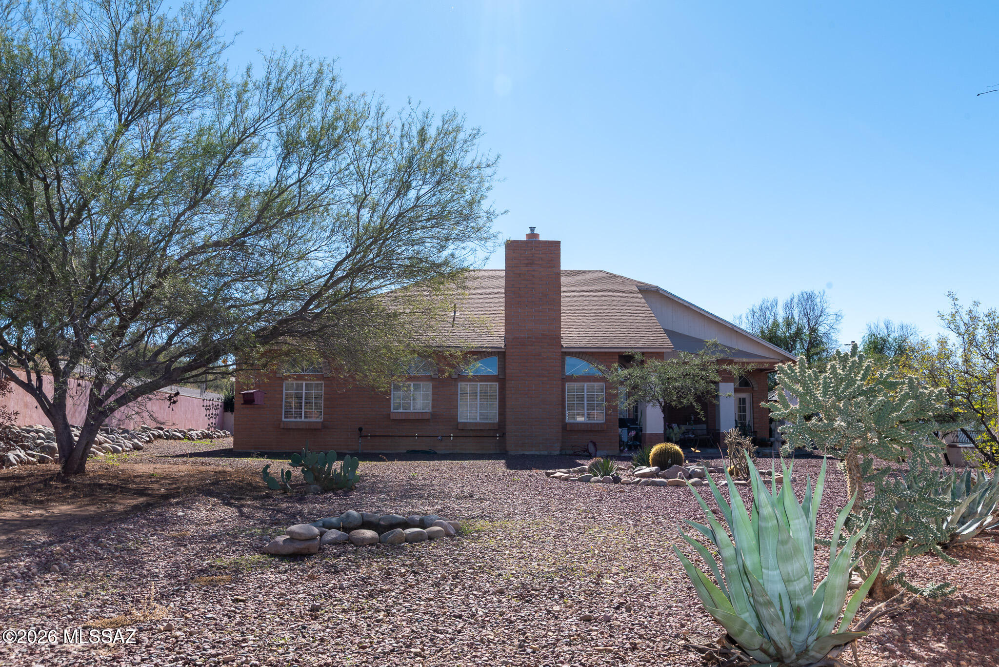 1242 Vista Court Rio Rico, AZ 85648 - Photo 14 of 16 a view of a house with backyard and trees
