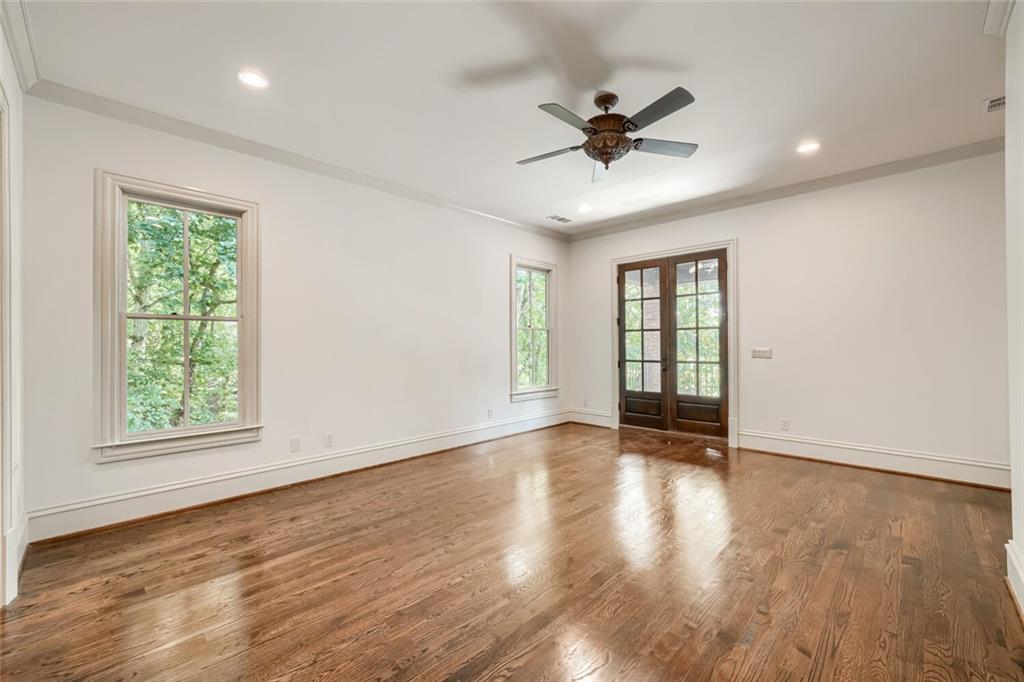7965 Robin Road Cumming, GA 30041 - Photo 29 of 64 a view of an empty room with a window and wooden floor