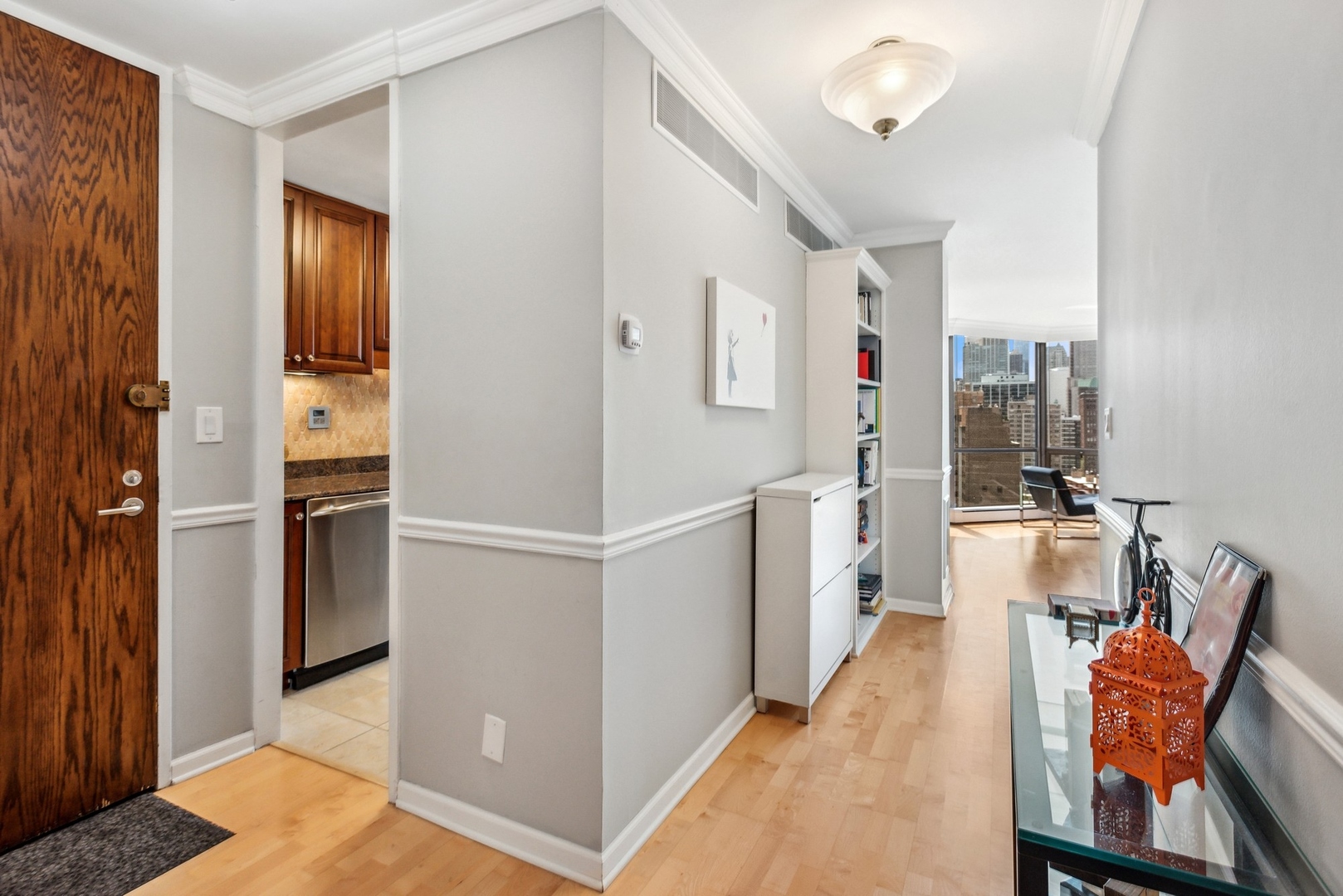 1310 North Ritchie Court, Unit 19B Chicago, IL 60610 - Photo 14 of 30 a hallway with cabinets