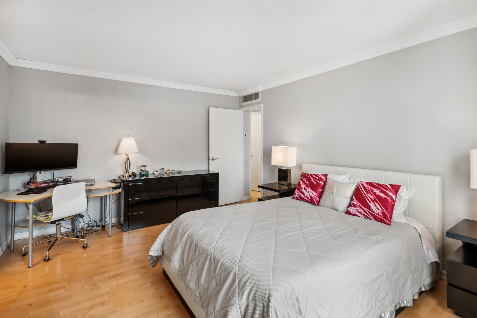 1310 North Ritchie Court, Unit 19B Chicago, IL 60610 - Photo 17 of 30 a bedroom with a bed and a desk