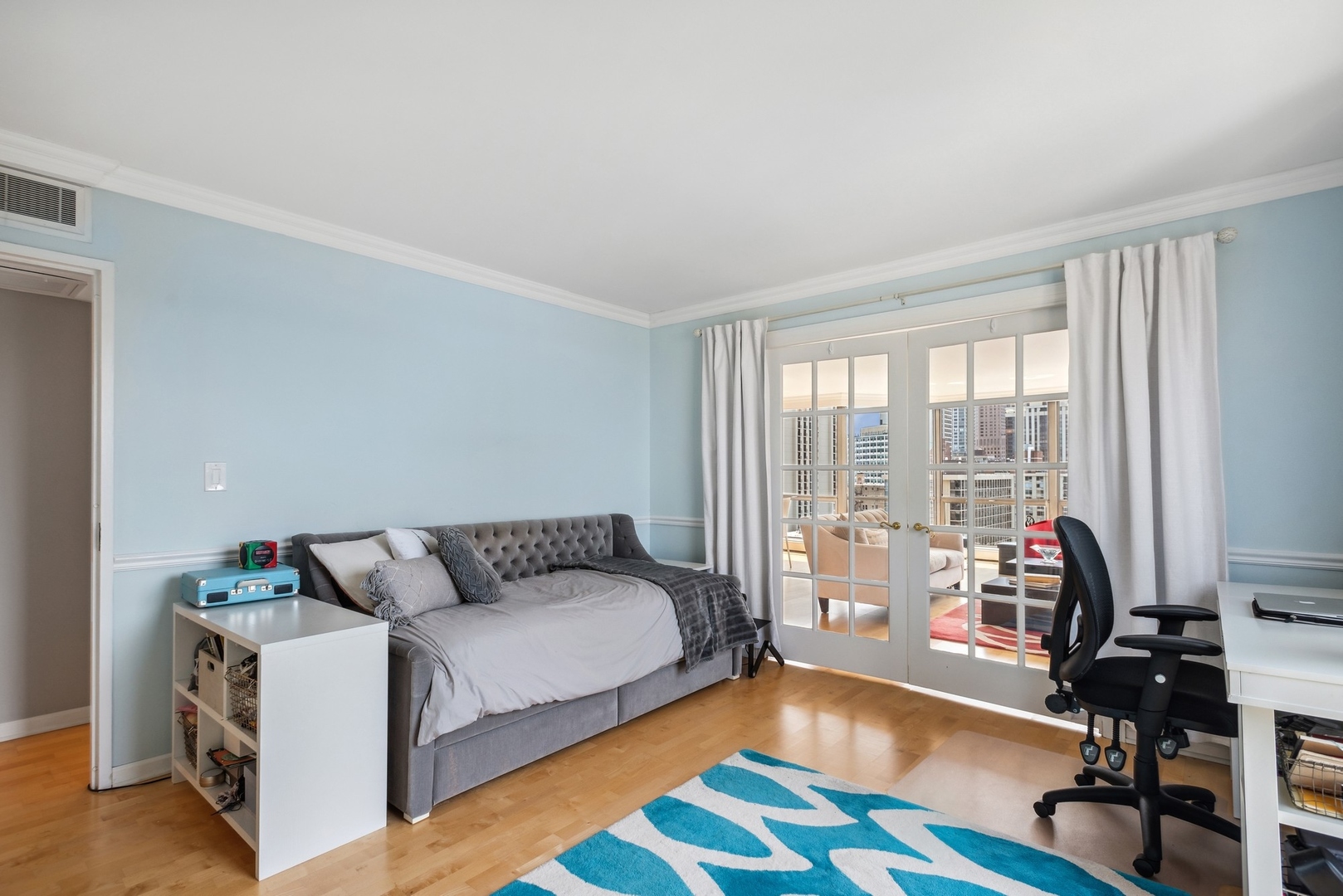 1310 North Ritchie Court, Unit 19B Chicago, IL 60610 - Photo 23 of 30 a bedroom with furniture and a large window