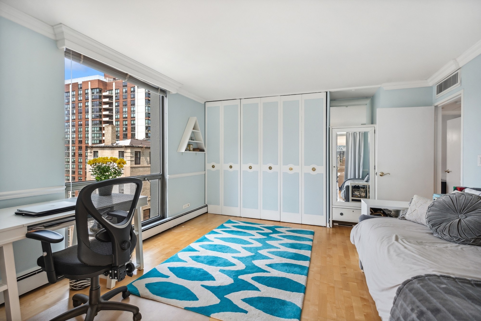 1310 North Ritchie Court, Unit 19B Chicago, IL 60610 - Photo 24 of 30 a bedroom with a bed and a window