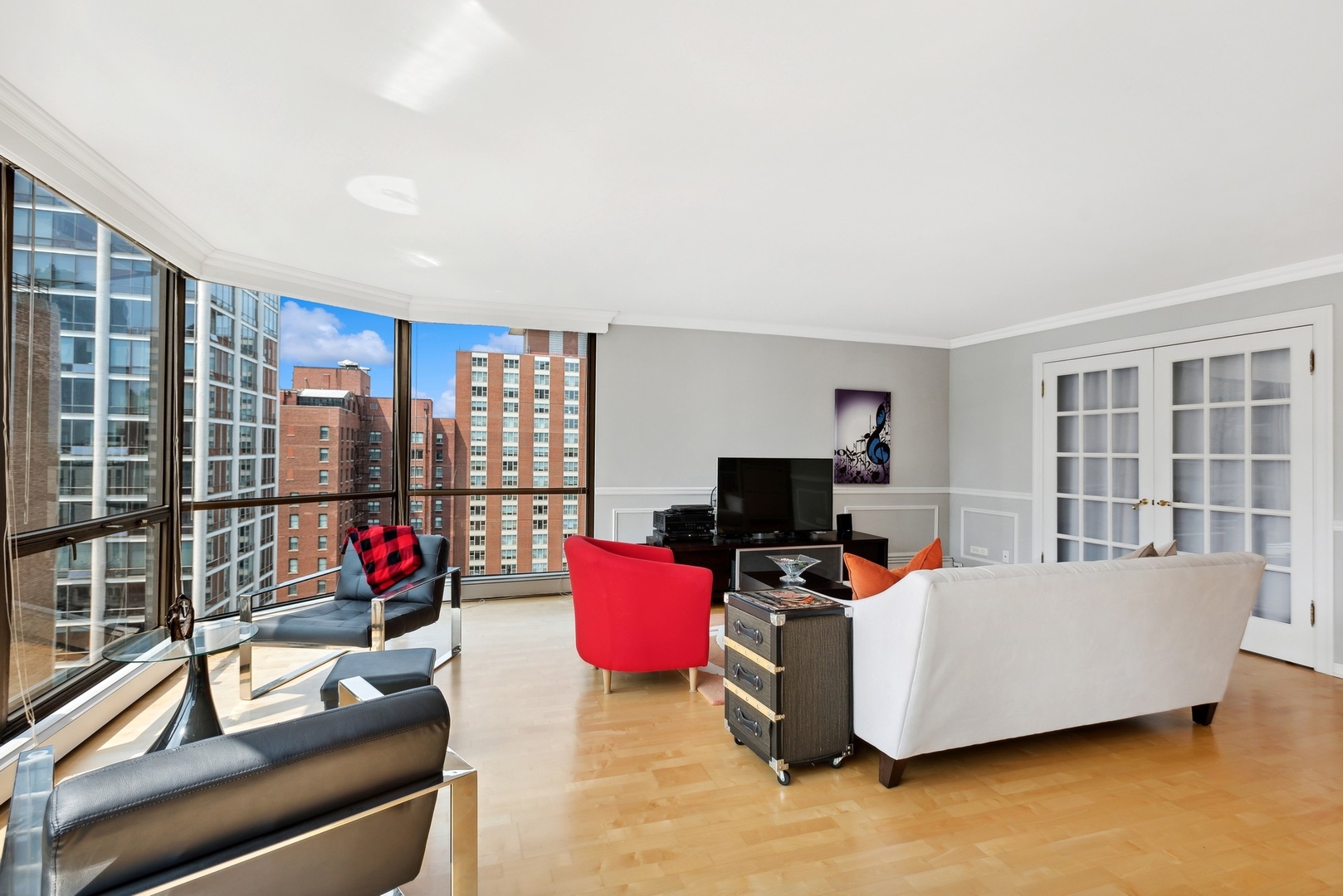1310 North Ritchie Court, Unit 19B Chicago, IL 60610 - Photo 5 of 30 a living room with furniture and a flat screen tv