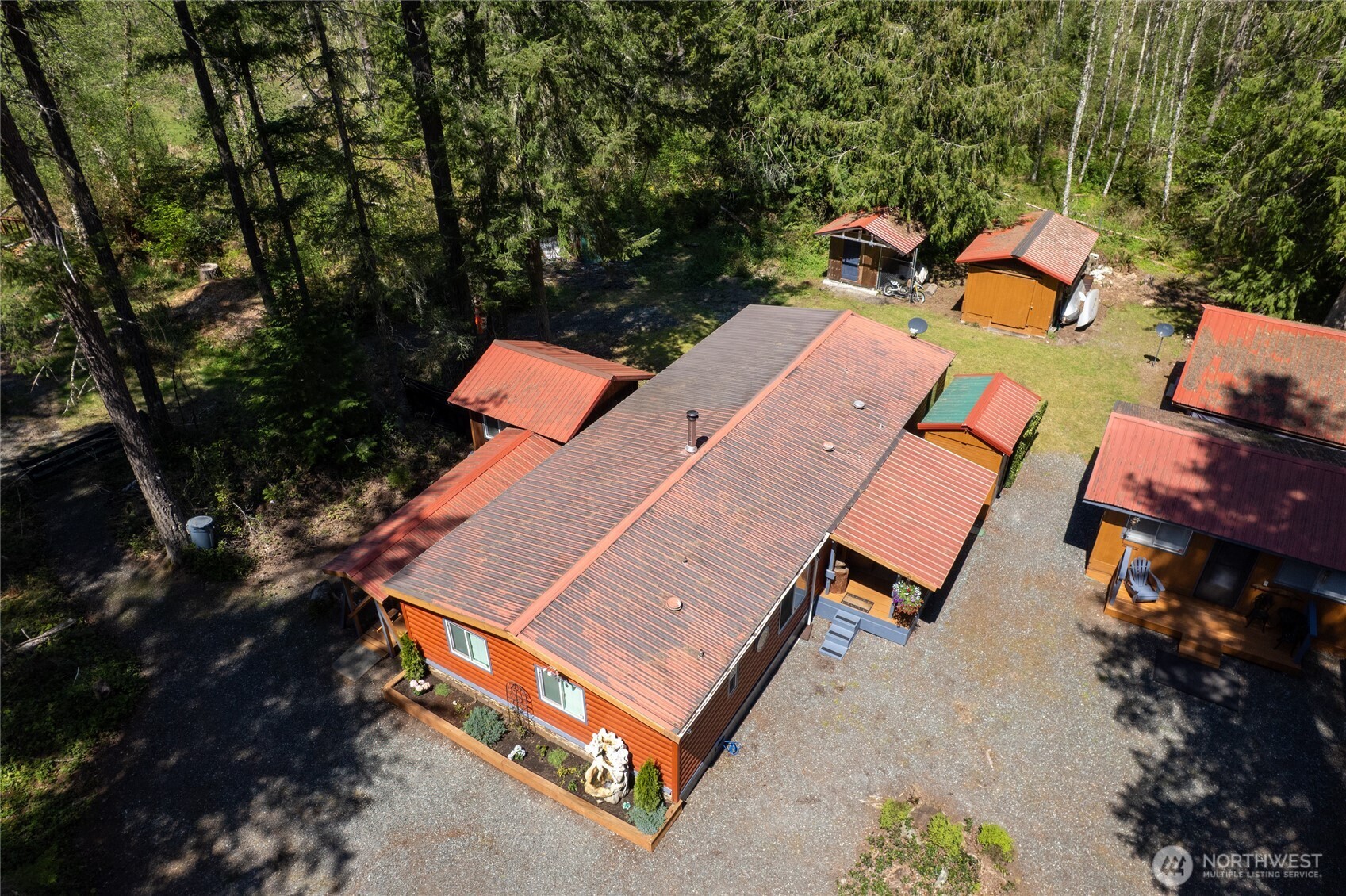271 Skate Creek Road North Ashford, WA 98304 - Photo 38 of 40 an aerial view of a house with a yard and trees