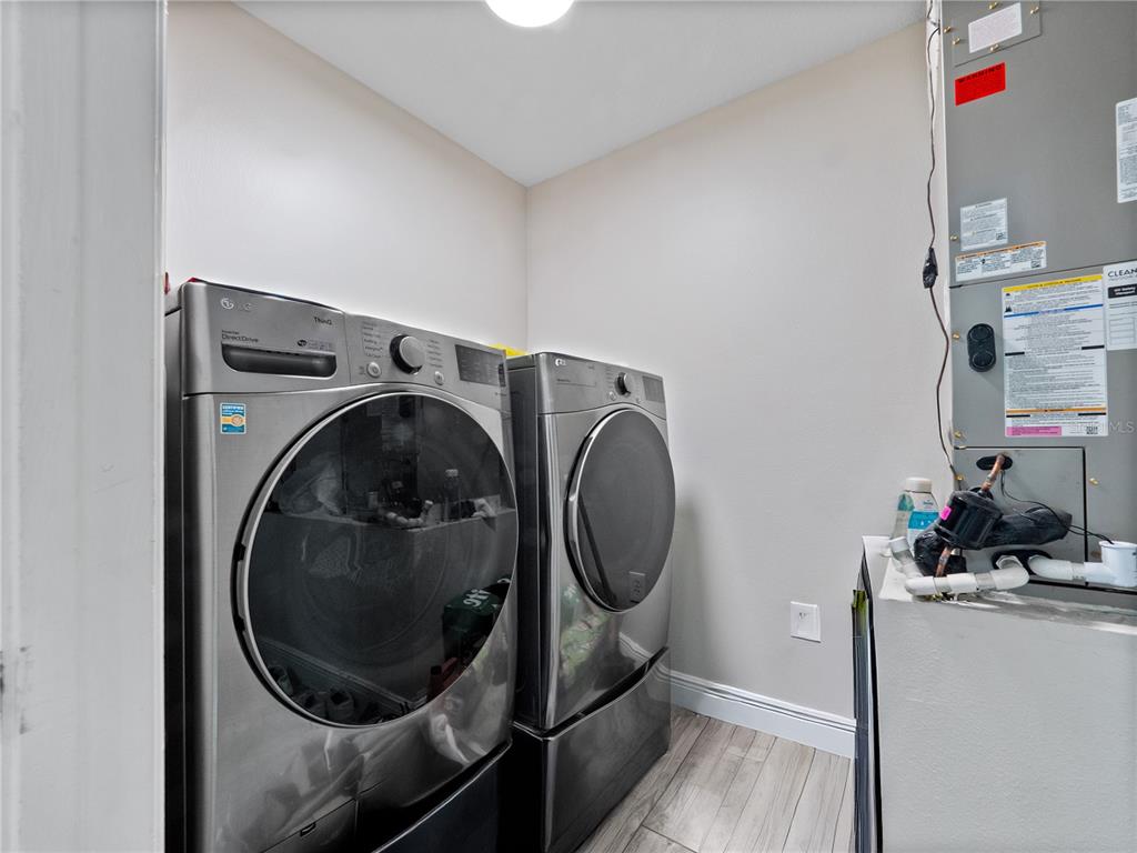 117 Rachel Lin Lane St. Cloud, FL 34771 - Photo 18 of 28 a utility room with dryer and washer