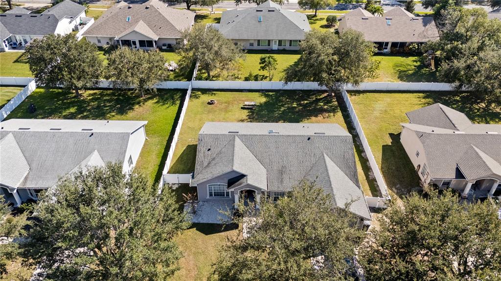 117 Rachel Lin Lane St. Cloud, FL 34771 - Photo 25 of 28 an aerial view of a house with a garden and a lake view