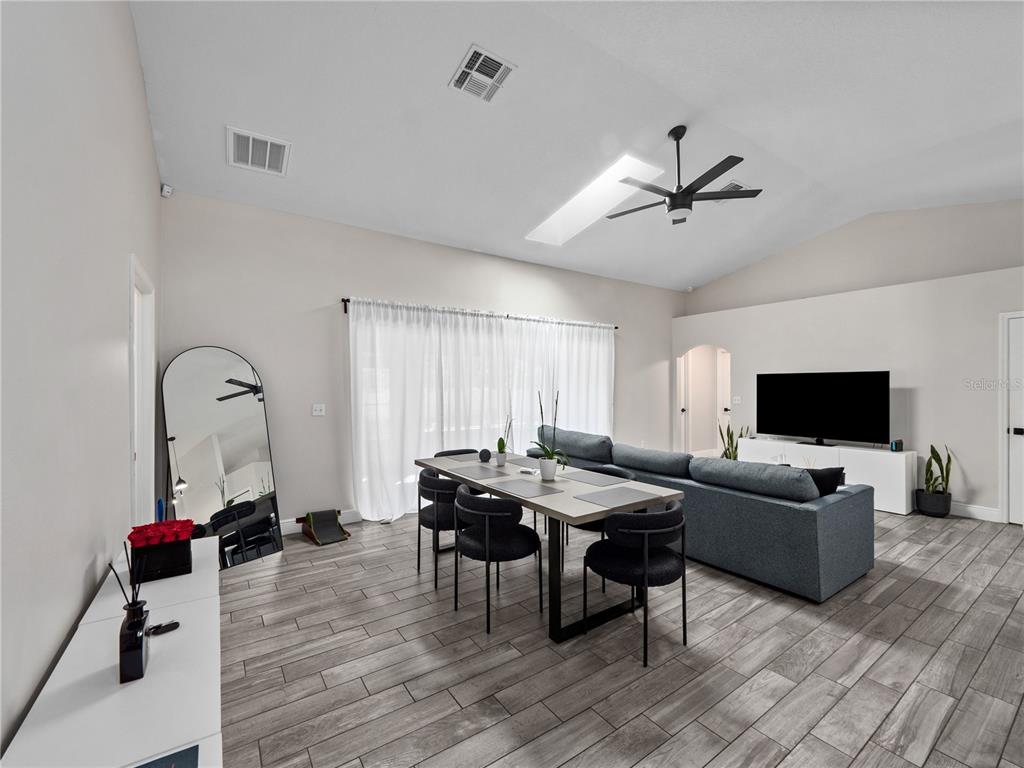 117 Rachel Lin Lane St. Cloud, FL 34771 - Photo 7 of 28 a living room with furniture and a flat screen tv