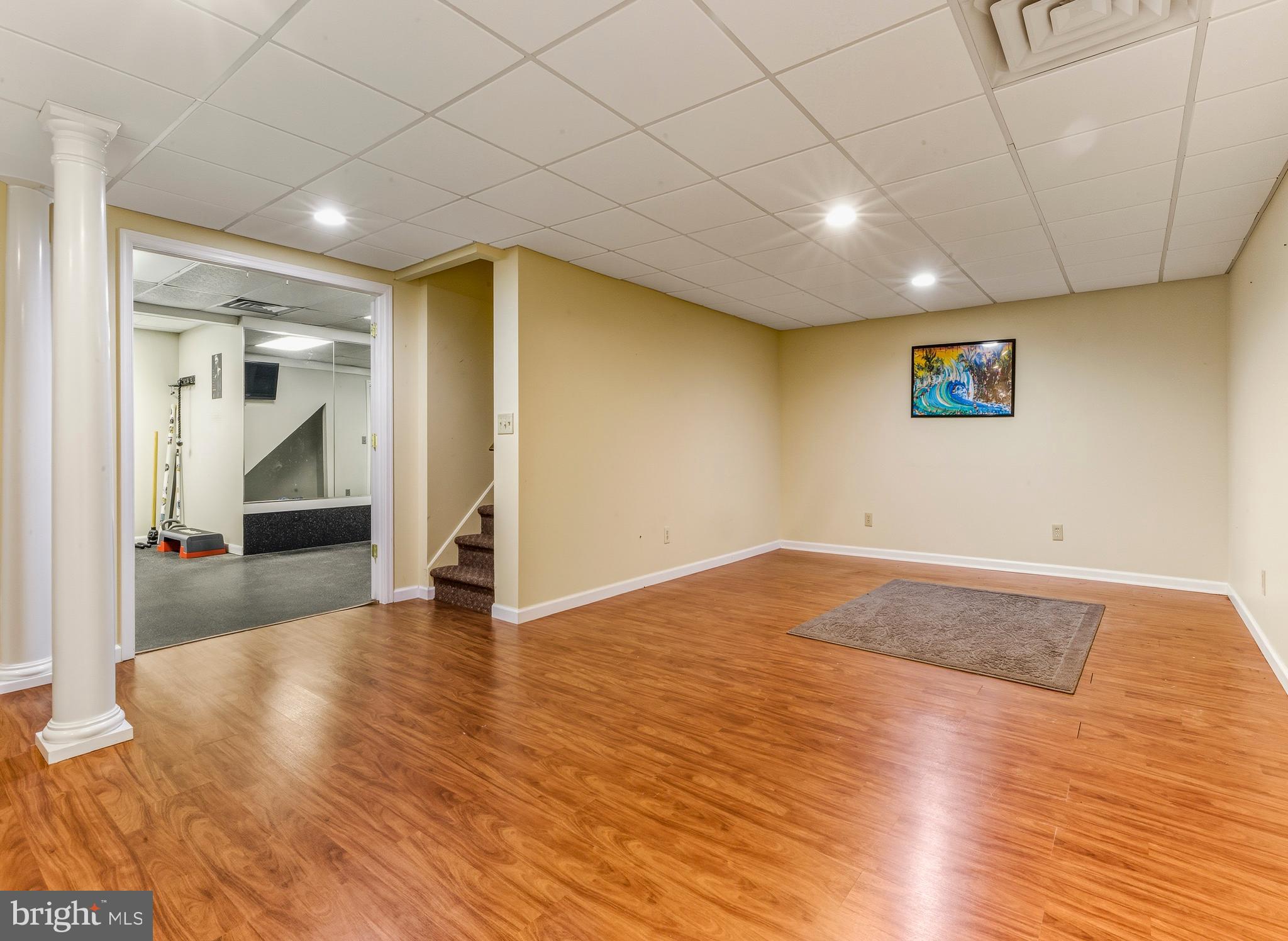 174 Pitman Downer Road Sewell, NJ 08080 - Photo 40 of 52 a view of empty room with wooden floor