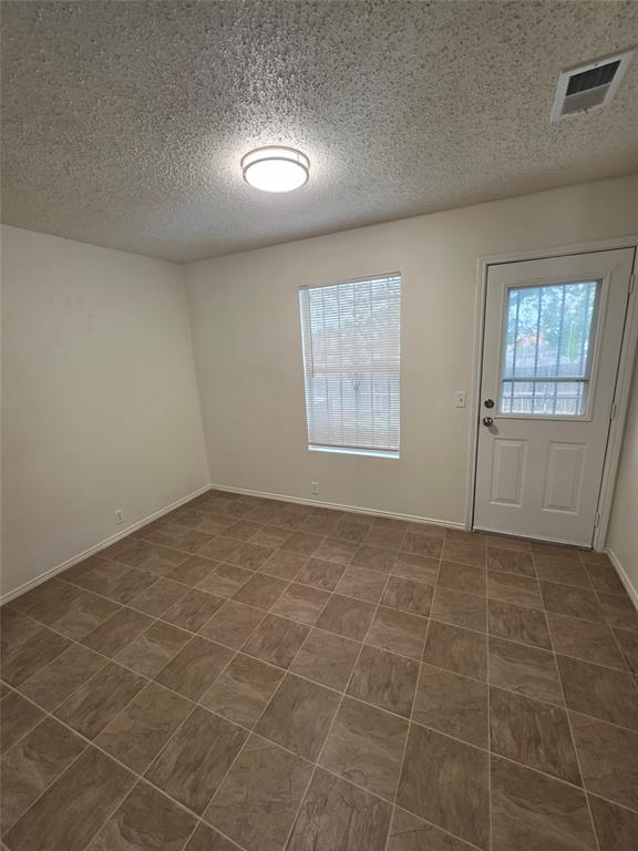 725 Trinity Lane Dallas, TX 75241 - Photo 4 of 10 an empty room with windows