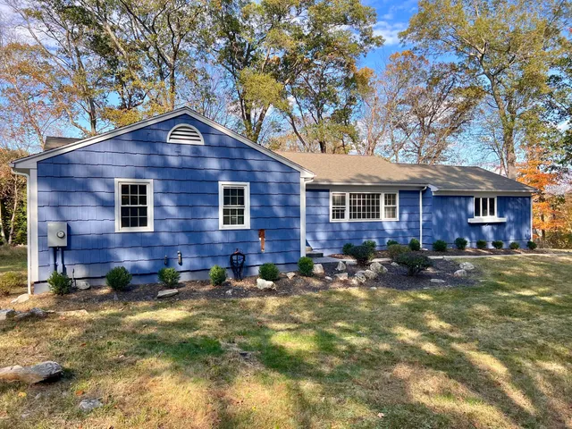 a front view of a house with a yard
