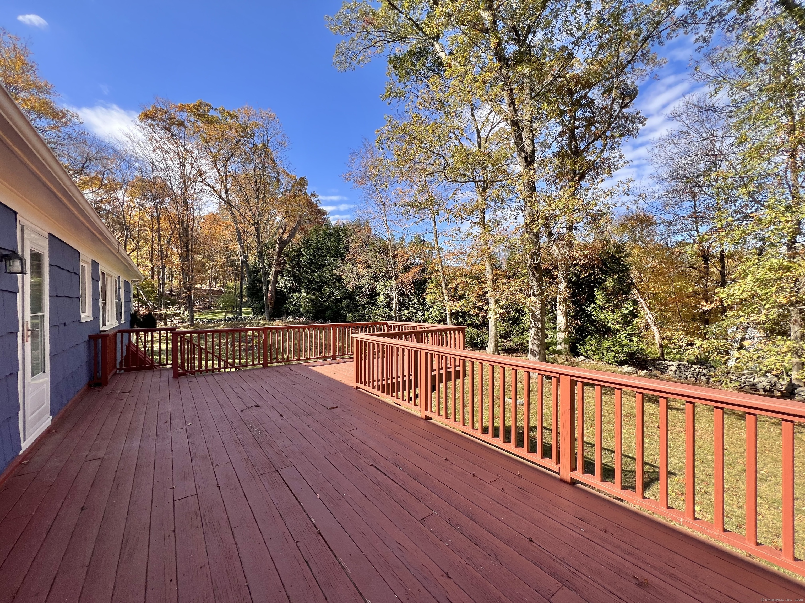 56 Partrick Road Westport, CT 06880 - Photo 15 of 21 a view of a balcony with wooden floor and fence