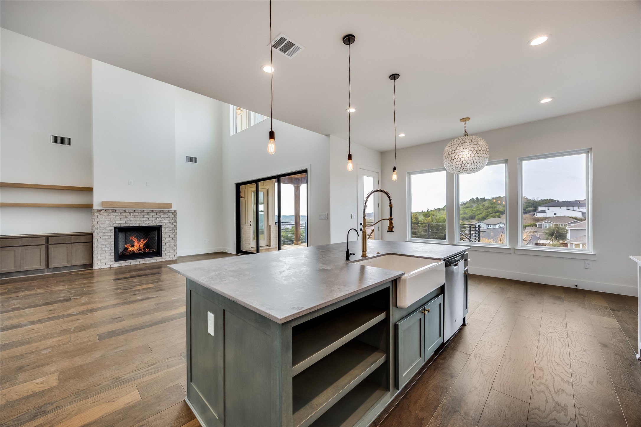 288 Smoke Tree Circle Dripping Springs, TX 78620 - Photo 11 of 40 a open kitchen with sink cabinets and wooden floor