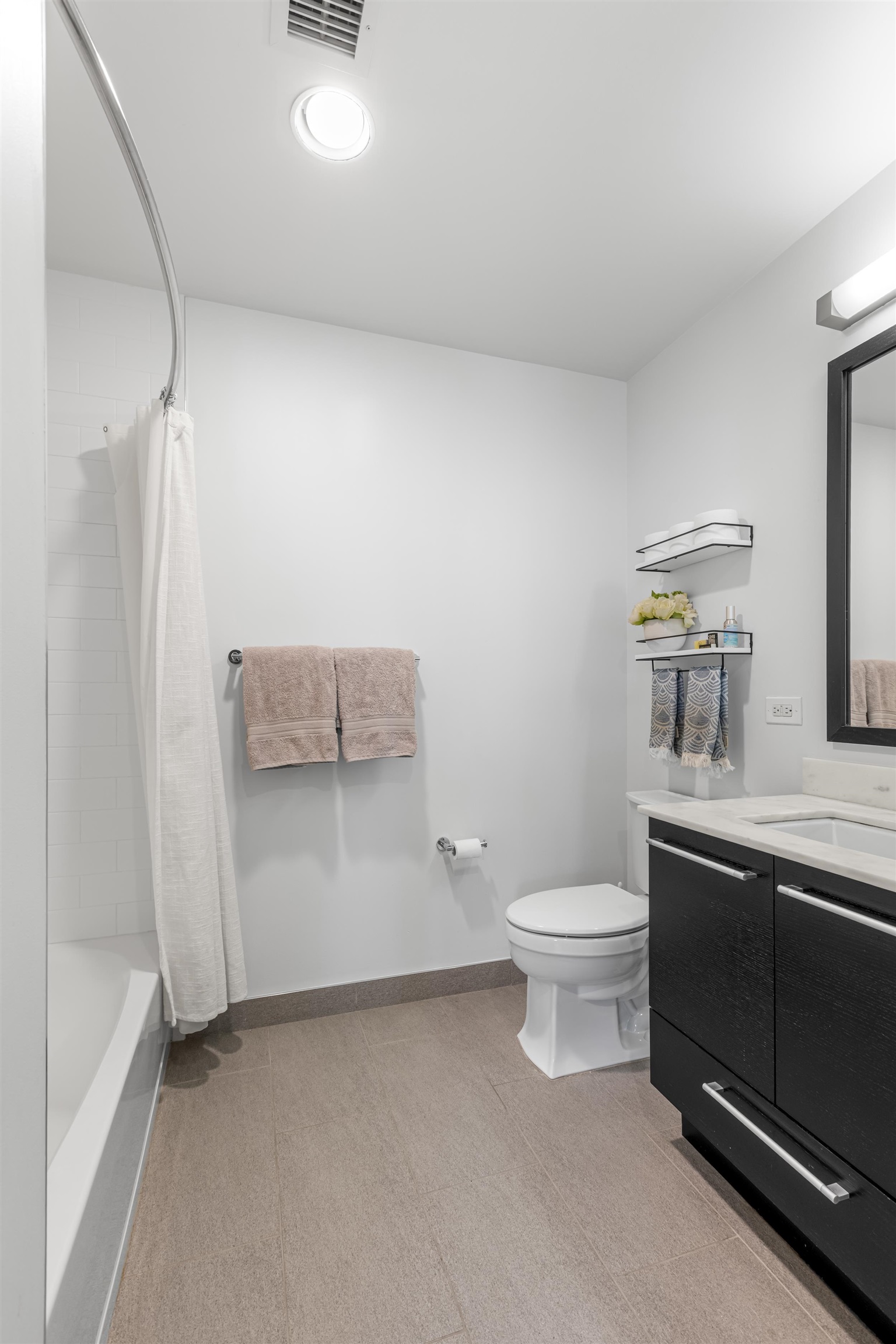 1450 Washington Street, Unit 608 Hoboken, NJ 07030 - Photo 14 of 44 a bathroom with a toilet a sink and bathtub